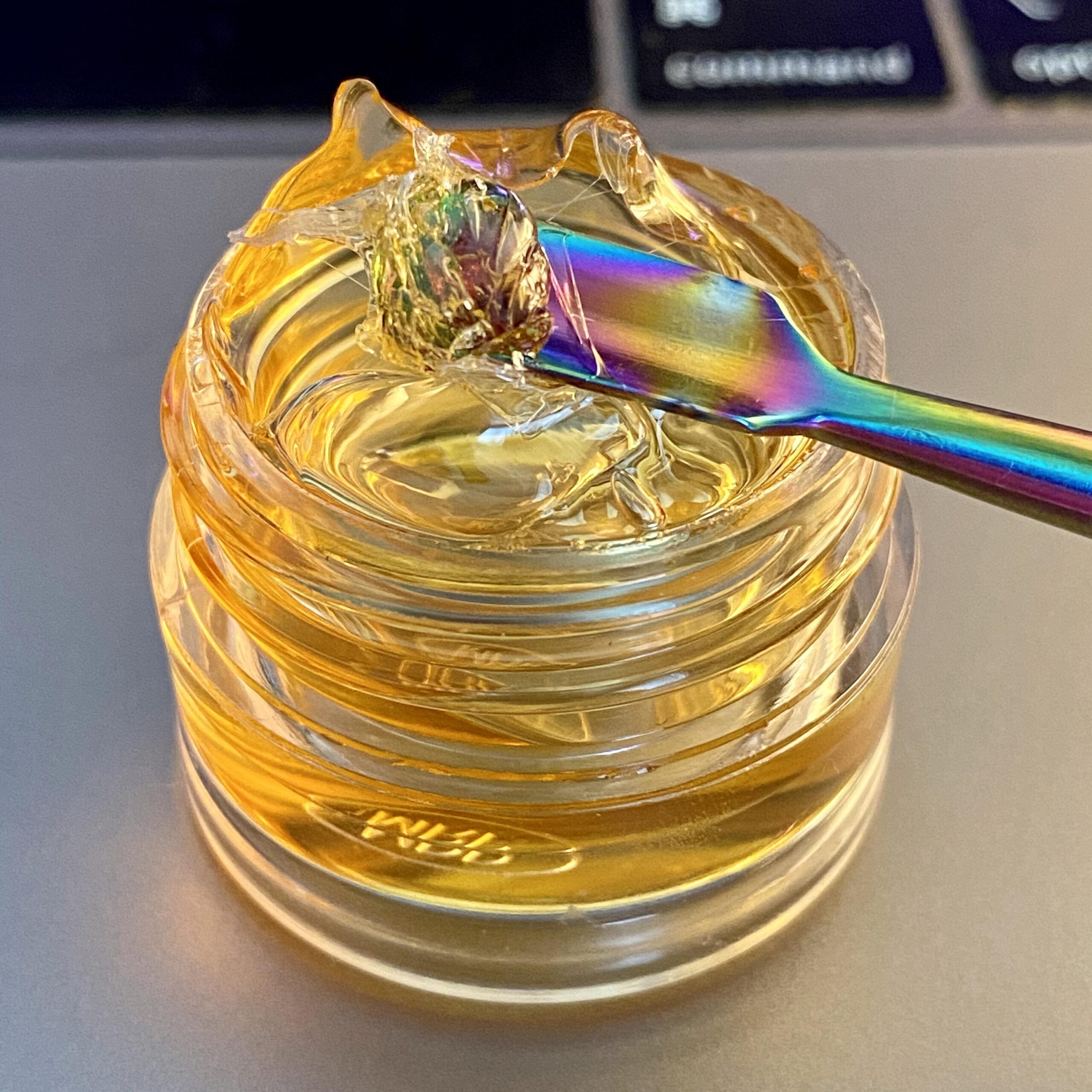 Thick THC distillate with spatula